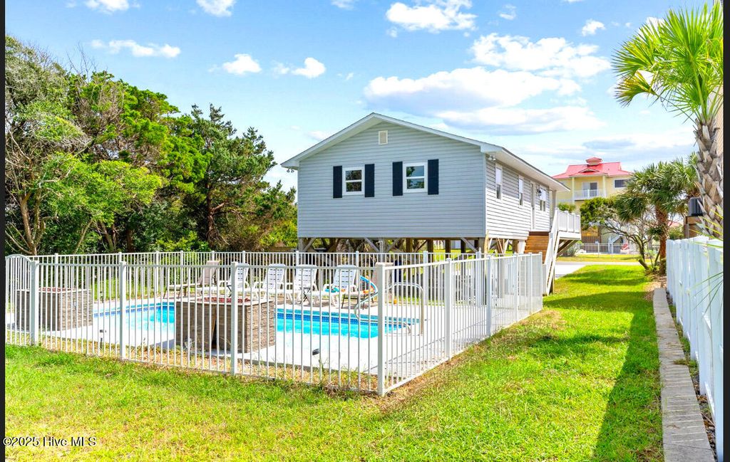 Photo of 220 W Dolphin Drive, Oak Island, NC 28465 (MLS # 100493245)