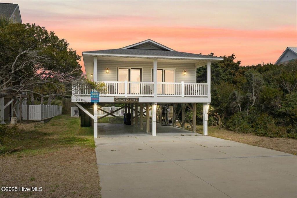 Photo of 220 W Dolphin Drive, Oak Island, NC 28465 (MLS # 100493245)