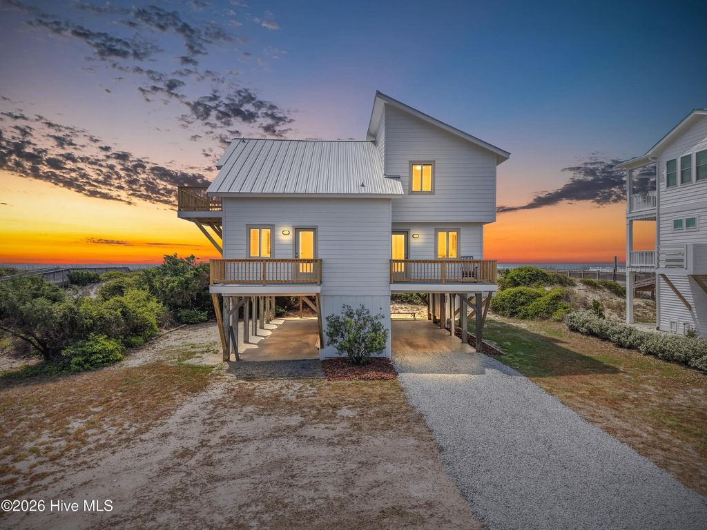 Photo of 645 Caswell Beach Road, Oak Island, NC 28465 (MLS # 100569528)