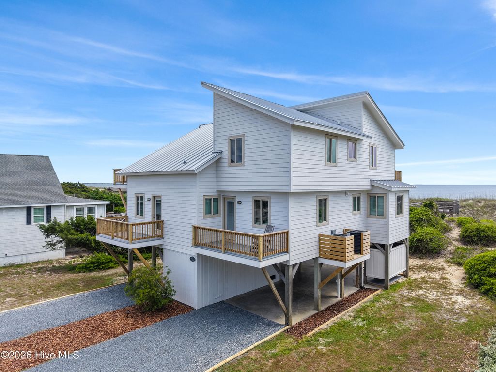 Photo of 645 Caswell Beach Road, Oak Island, NC 28465 (MLS # 100569528)