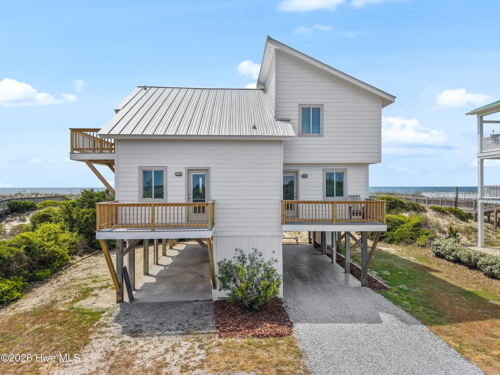 Photo of 645 Caswell Beach Road, Oak Island, NC 28465 (MLS # 100569528)