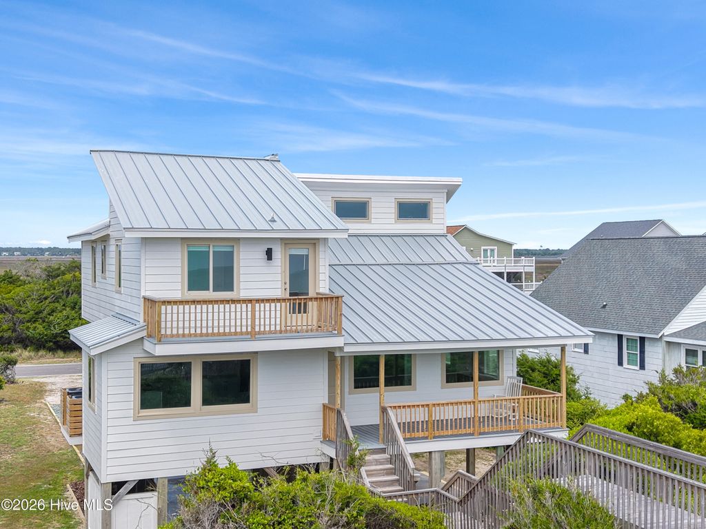 Photo of 645 Caswell Beach Road, Oak Island, NC 28465 (MLS # 100569528)
