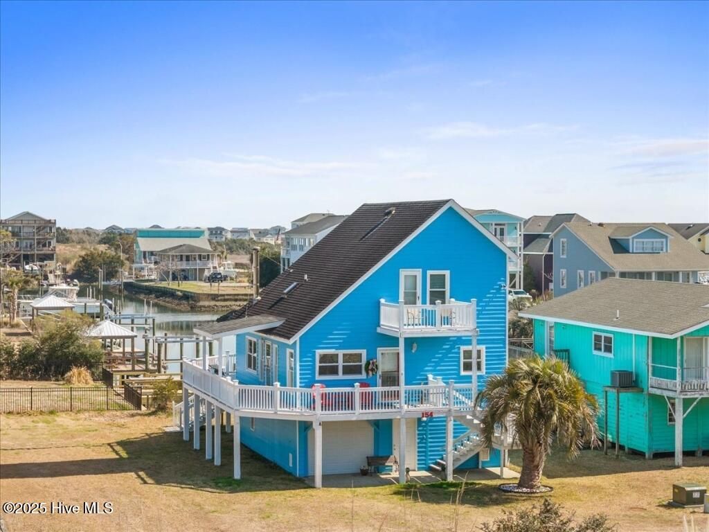 Photo of 154 Sand Dollar Street, Holden Beach, NC 28462 (MLS # 100507121)