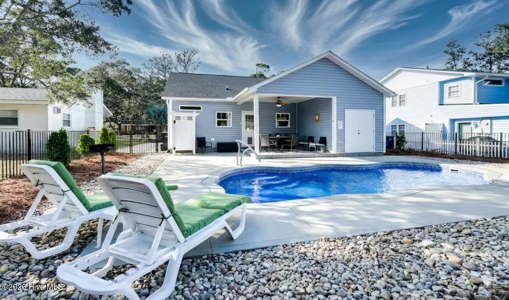 Photo of 310 Crowell Street, Oak Island, NC 28465 (MLS # 100559690)