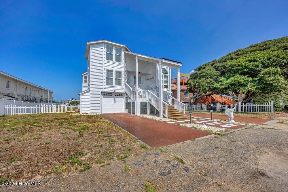 Photo of 203 Norton Street, Oak Island, NC 28465 (MLS # 100590101)