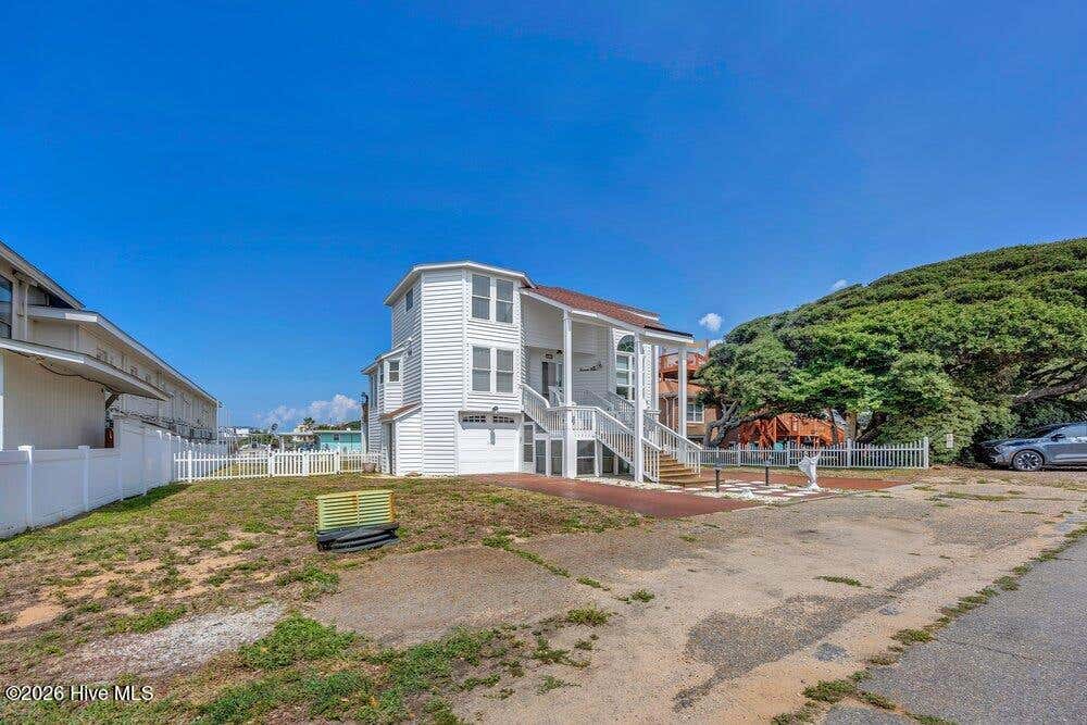 Photo of 203 Norton Street, Oak Island, NC 28465 (MLS # 100590101)