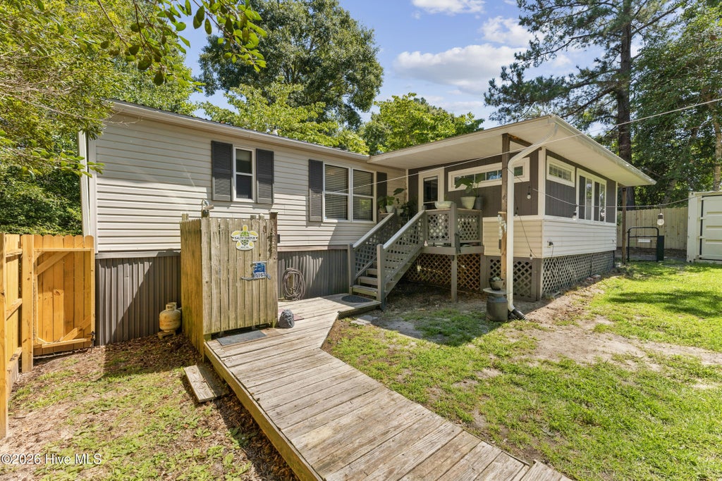 Photo of 303 Buck Drive, Hampstead, NC 28443 (MLS # 100601012)