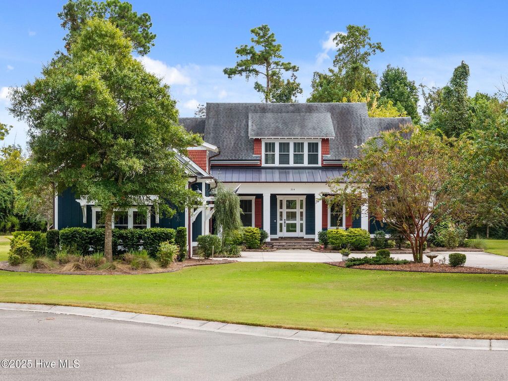 Photo of 314 E Rolling Meadows Road, Hampstead, NC 28443 (MLS # 100532333)