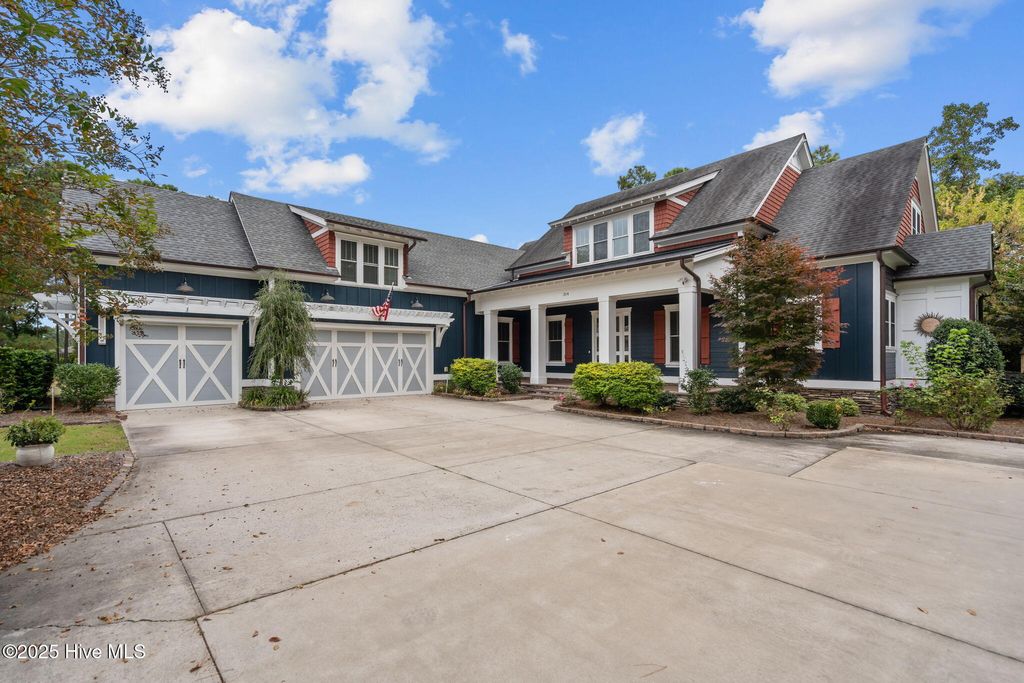 Photo of 314 E Rolling Meadows Road, Hampstead, NC 28443 (MLS # 100532333)