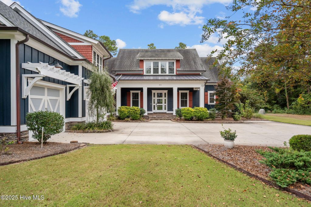 Photo of 314 E Rolling Meadows Road, Hampstead, NC 28443 (MLS # 100532333)