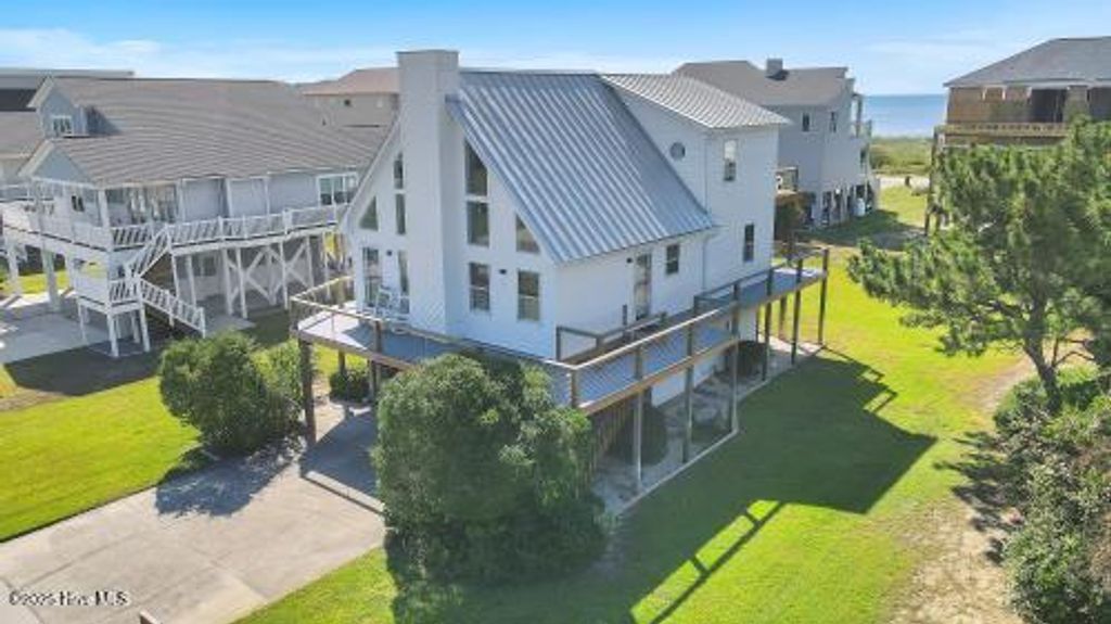 Photo of 6707 Kings Lynn Drive, Oak Island, NC 28465 (MLS # 100510345)