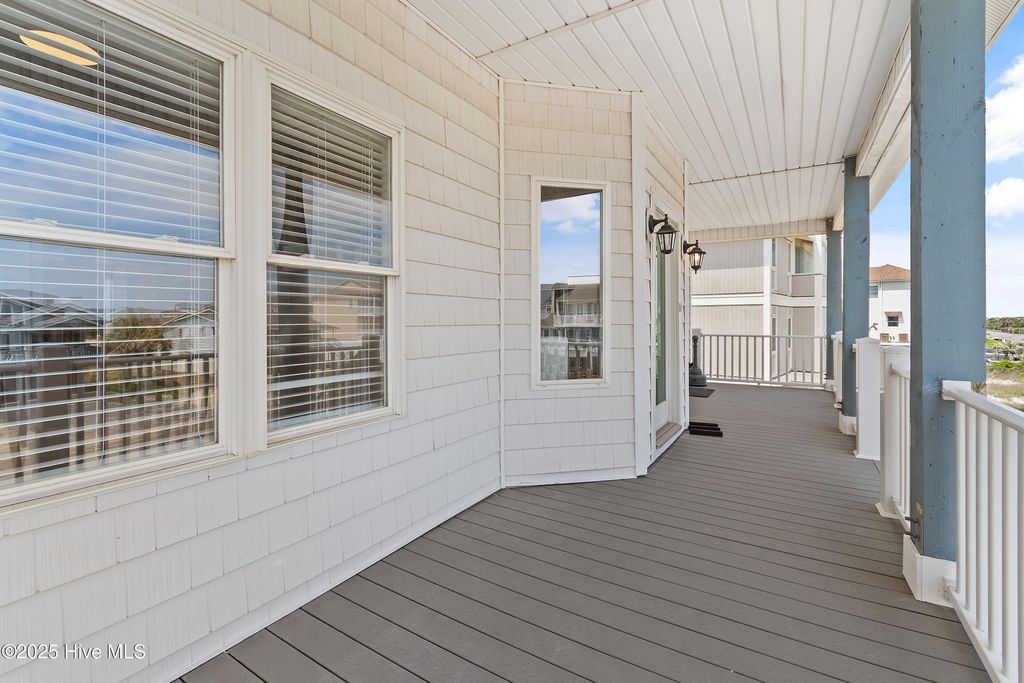 Photo of 6621 W Beach Drive, Oak Island, NC 28465 (MLS # 100554405)