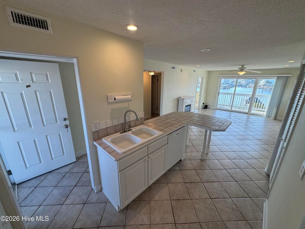 Photo of 709 Canal Drive #Apt 2c, Carolina Beach, NC 28428 (MLS # 100550642)