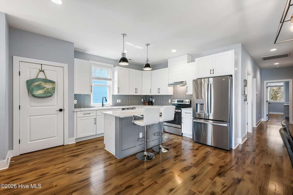 Photo of 119 NE 27th Street, Oak Island, NC 28465 (MLS # 100558467)