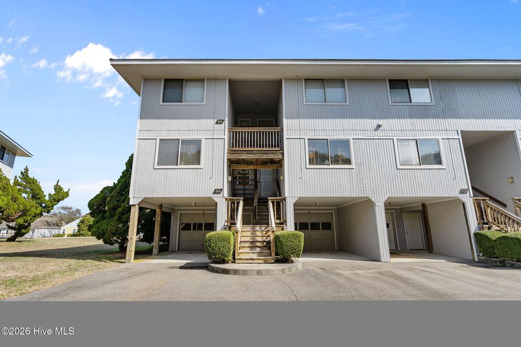 Photo of 35 Foxfire Trace, Oak Island, NC 28465 (MLS # 100558305)