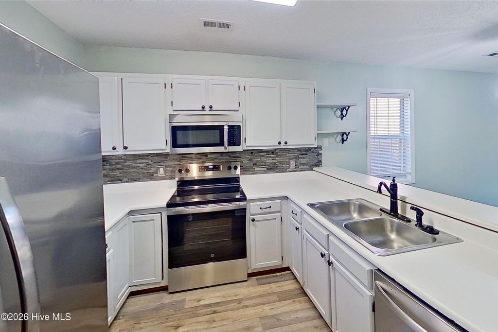 Photo of 5050 Lamppost Circle, Wilmington, NC 28403 (MLS # 100548619)