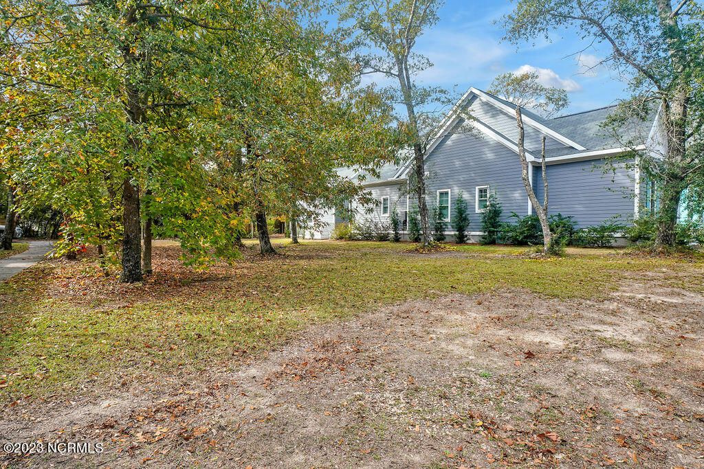 Photo of 411 Fire Fly Lane, Southport, NC 28461 (MLS # 100416455)