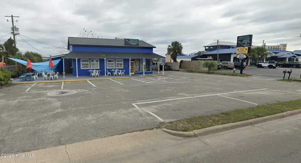 Photo of 304 N Lake Park Boulevard N, Carolina Beach, NC 28428 (MLS # 100595390)