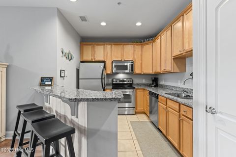 Tiny photo for 700 Ocean Drive #Unit 117, Oak Island, NC 28465 (MLS # 100545240)