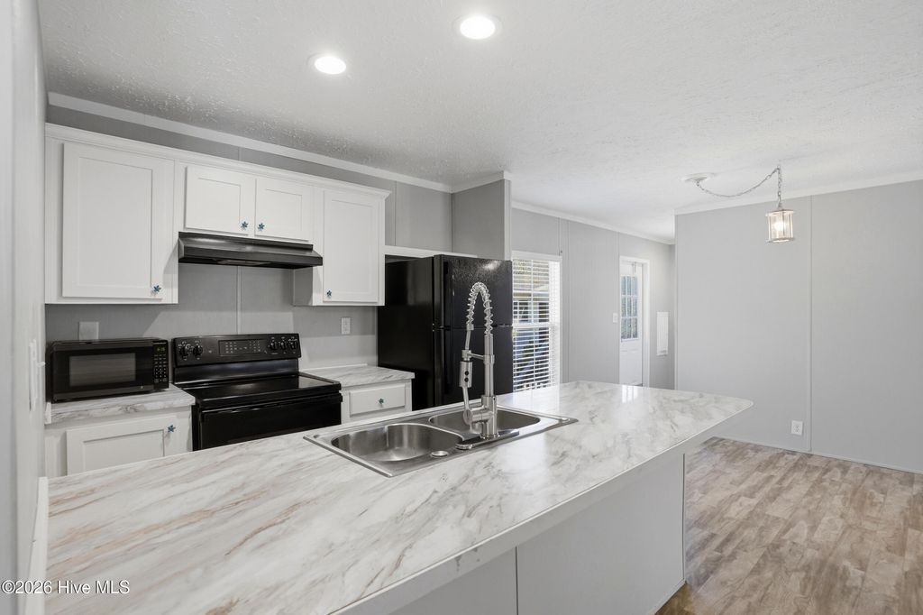 Photo of 8990 Bonaparte Drive SW, Sunset Beach, NC 28468 (MLS # 100564185)