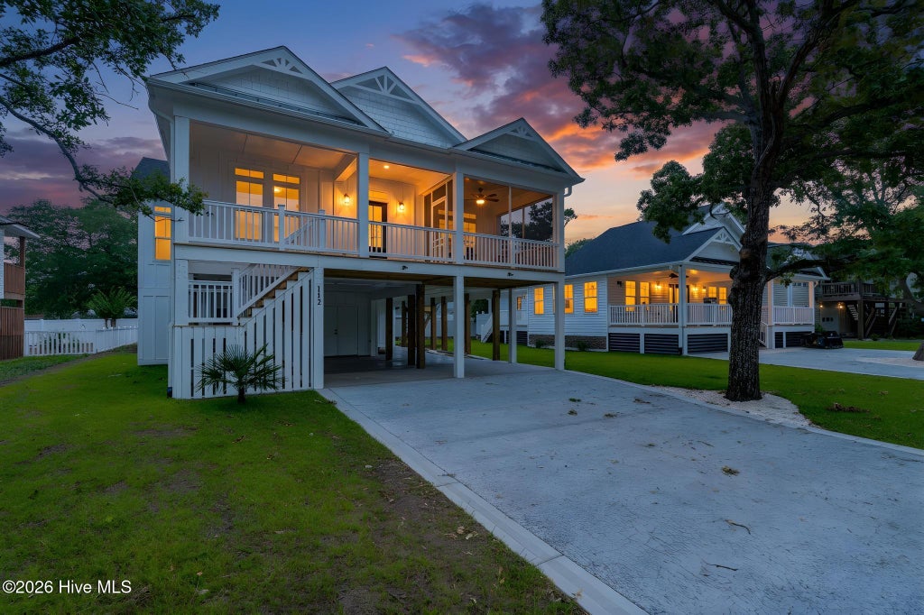 Photo of 112 NE 27th Street, Oak Island, NC 28465 (MLS # 100588476)