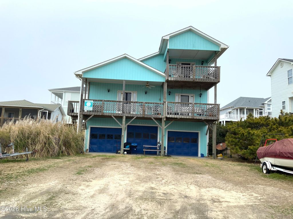 Photo of 1104 Ocean Drive, Oak Island, NC 28465 (MLS # 100555608)