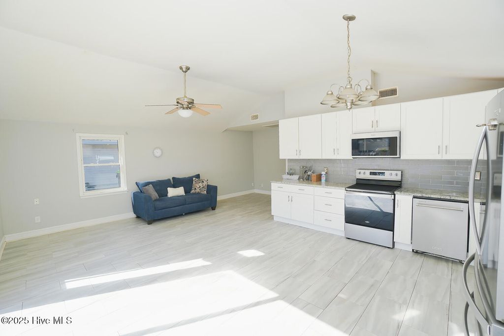Photo of 127 NW 10th Street, Oak Island, NC 28465 (MLS # 100534468)