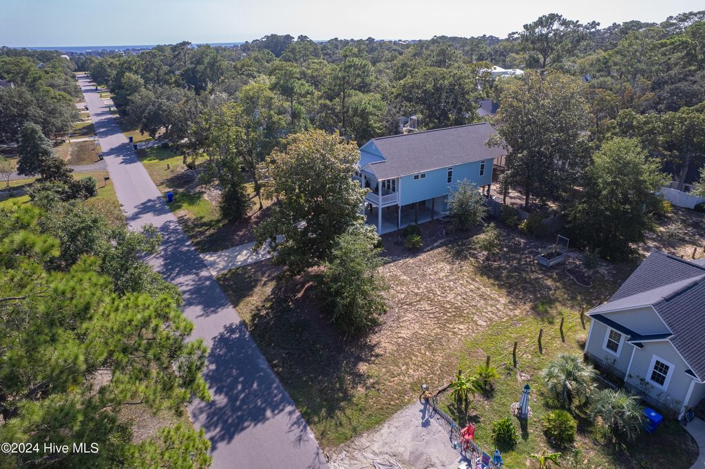 Photo of 127 NW 25th Street, Oak Island, NC 28465 (MLS # 100474045)