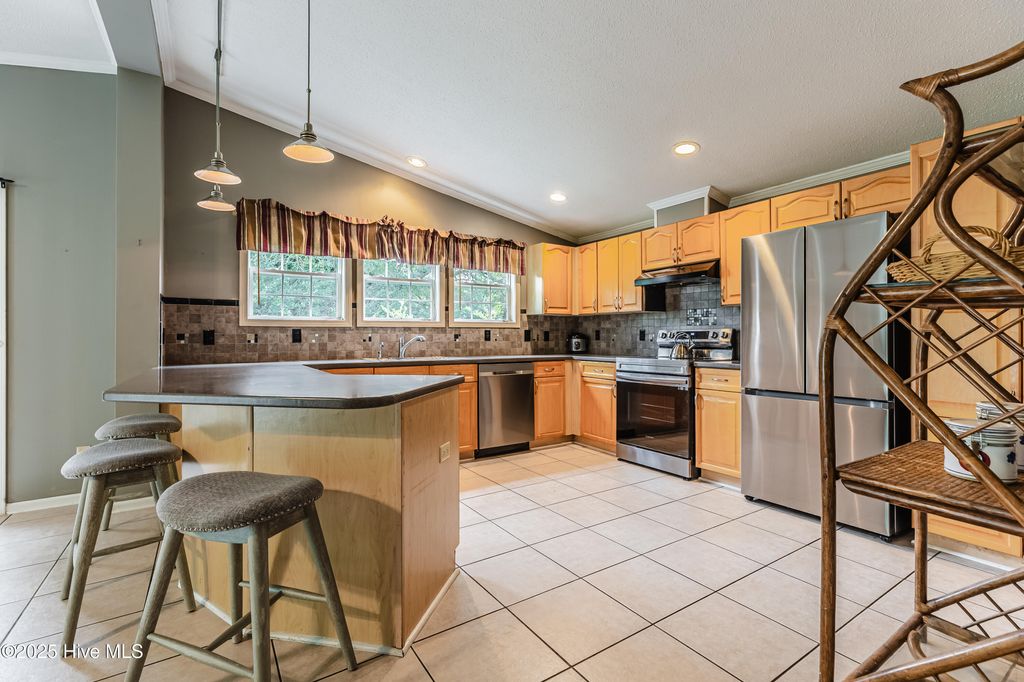 Photo of 4974 Peregrine Drive SW, Shallotte, NC 28470 (MLS # 100524257)