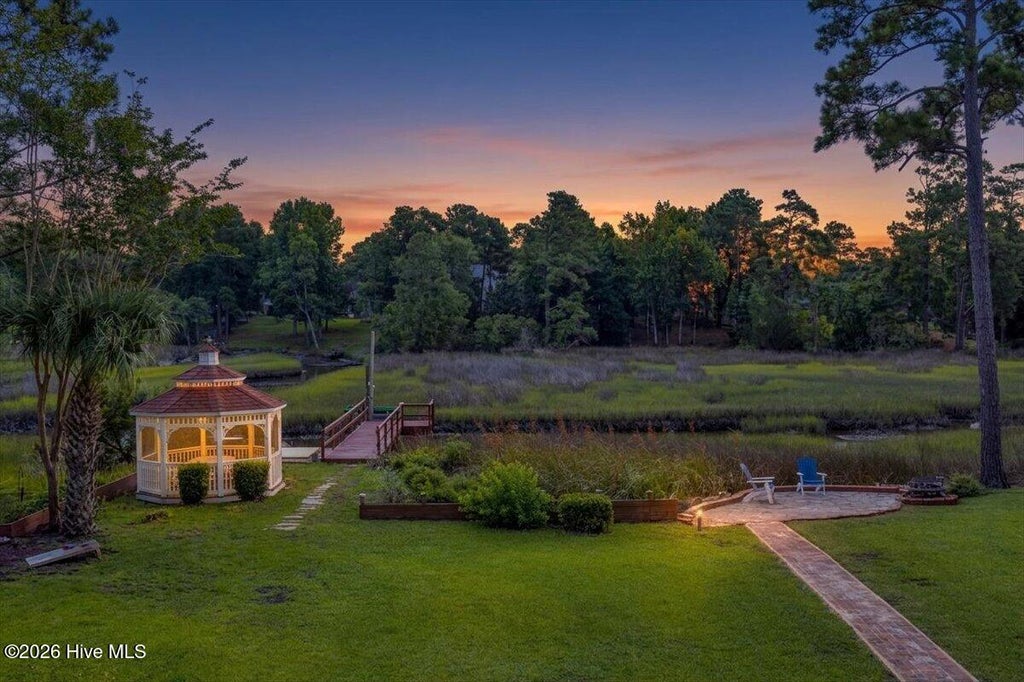Photo of 609 Sawgrass Road, Hampstead, NC 28443 (MLS # 100589009)