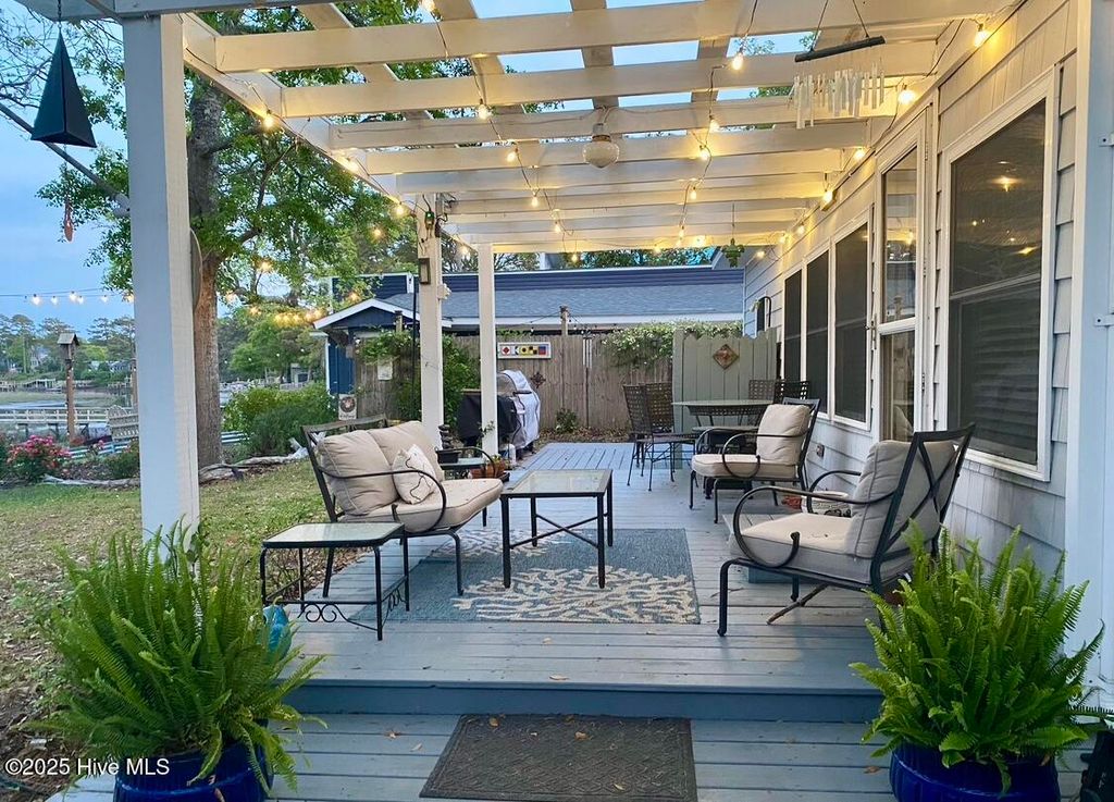 Photo of 7908 E Yacht Drive, Oak Island, NC 28465 (MLS # 100538347)