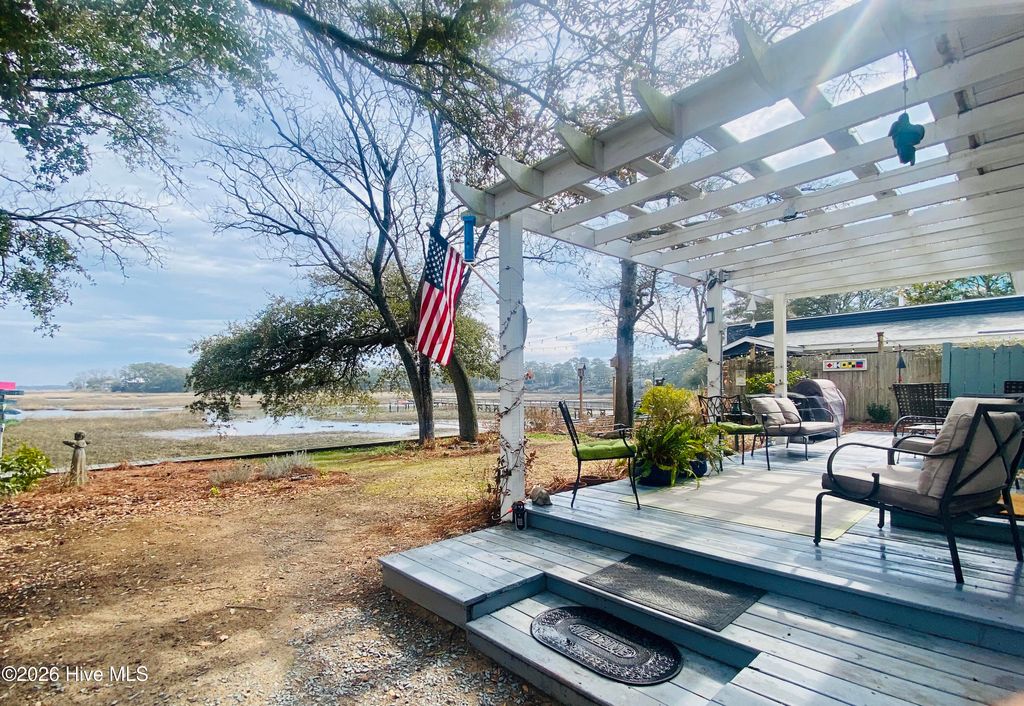 Photo of 7908 E Yacht Drive, Oak Island, NC 28465 (MLS # 100538347)