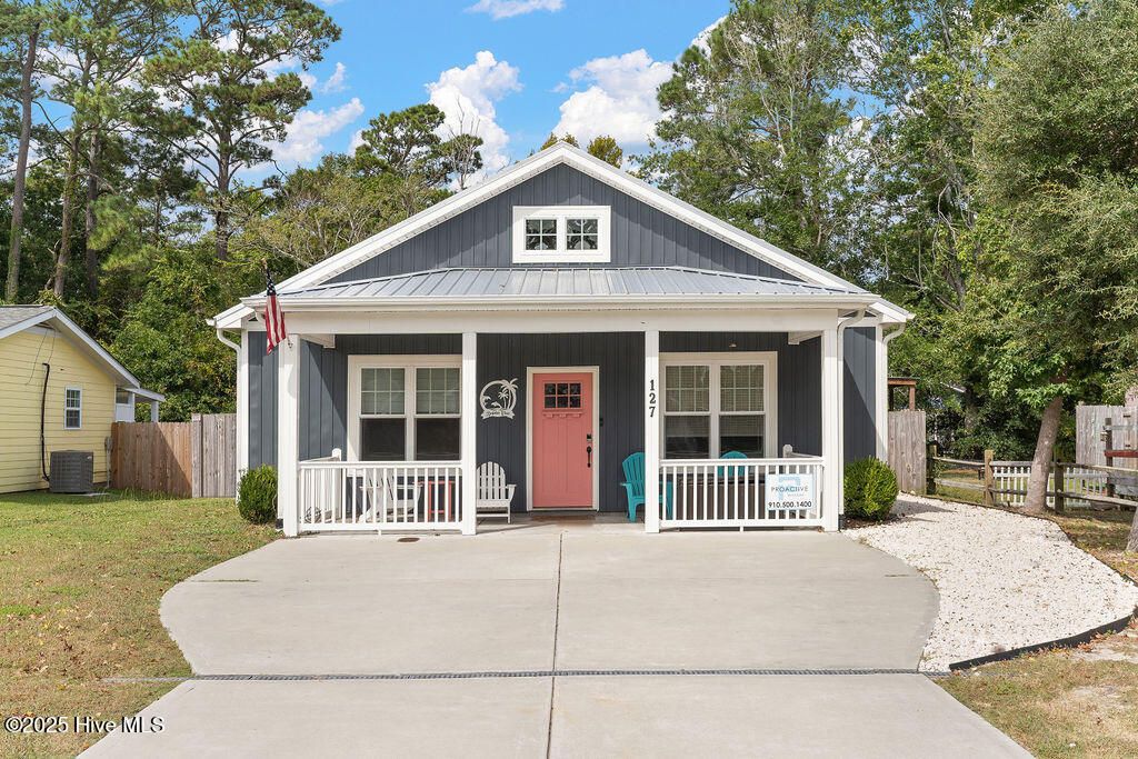 Photo of 127 NW 20th Street, Oak Island, NC 28465 (MLS # 100537139)