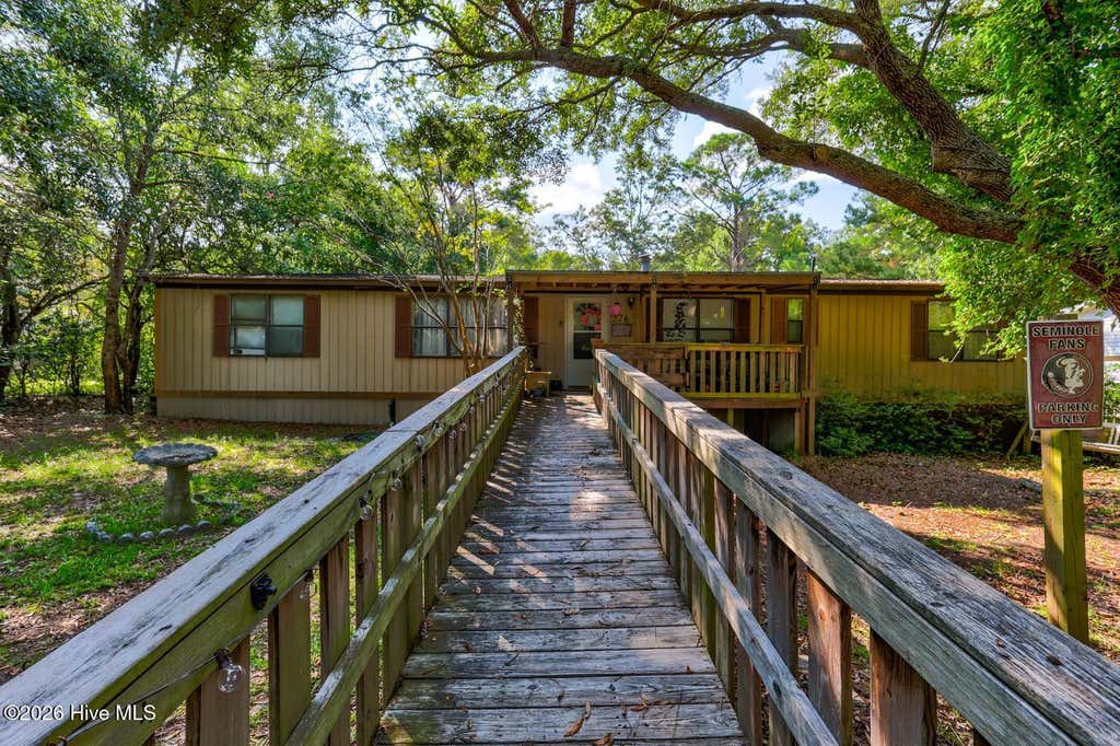Photo of 226 Dogwood Lane W, Hampstead, NC 28443 (MLS # 100596380)