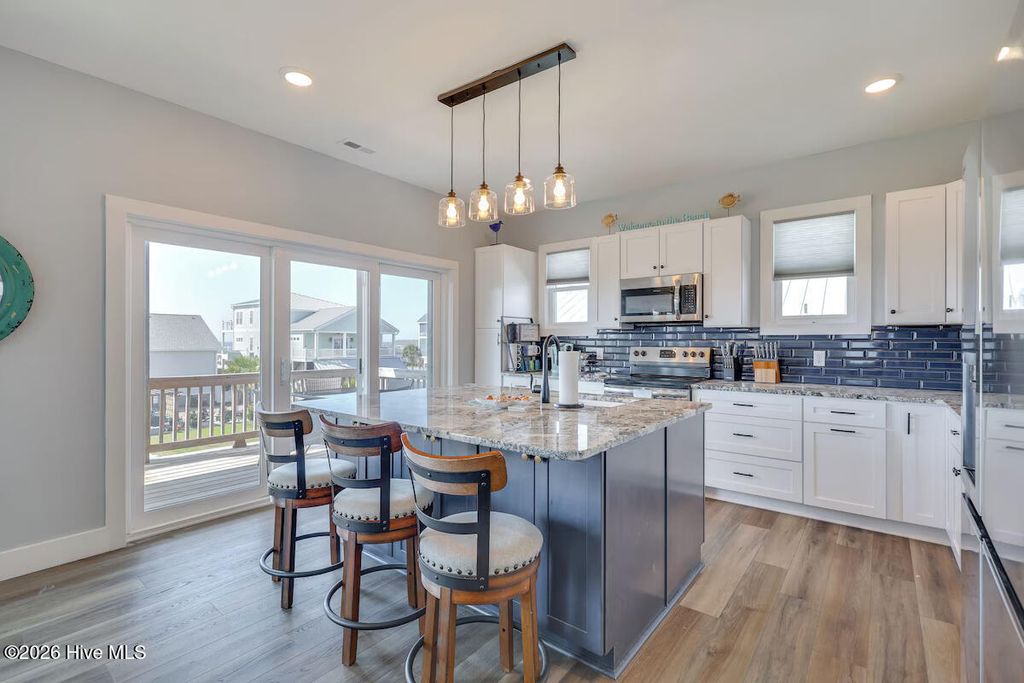Photo of 5205 E Pelican Drive, Oak Island, NC 28465 (MLS # 100577367)