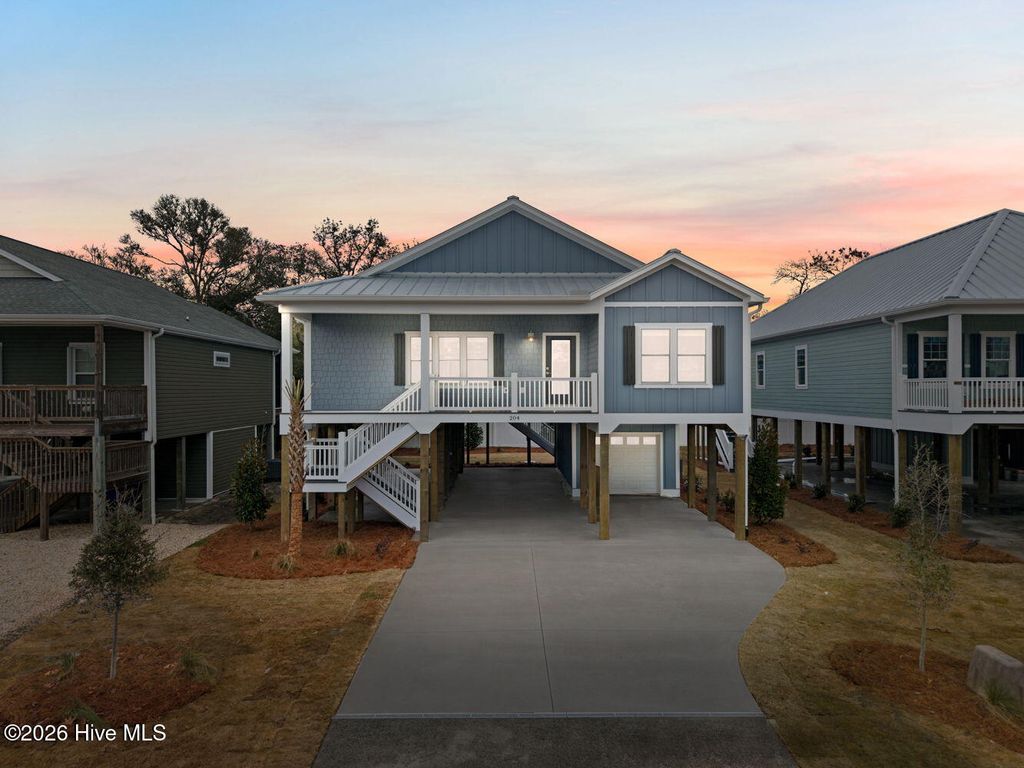 Photo of 310 NE 58th Street, Oak Island, NC 28465 (MLS # 100558448)