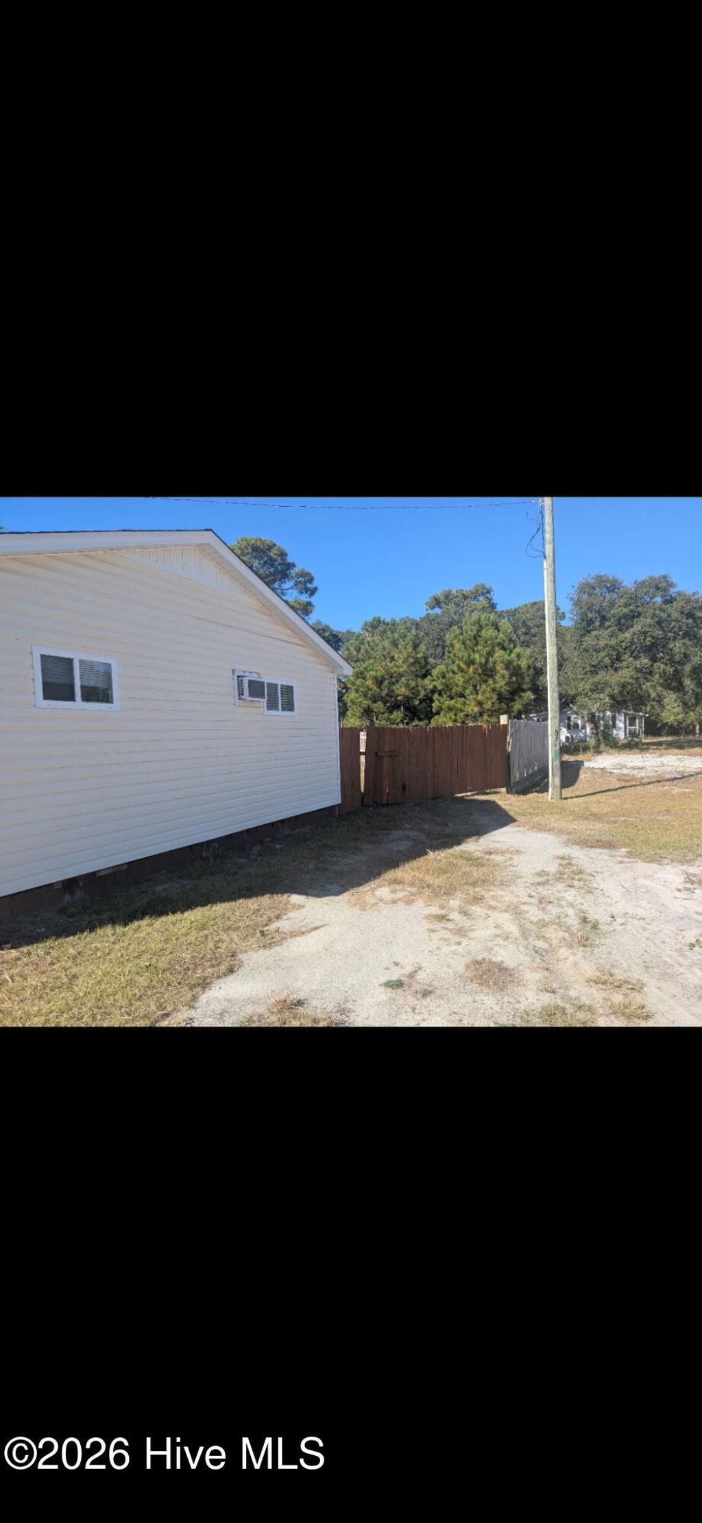 Photo of 7018 Beach Drive SW, Ocean Isle Beach, NC 28469 (MLS # 100553079)