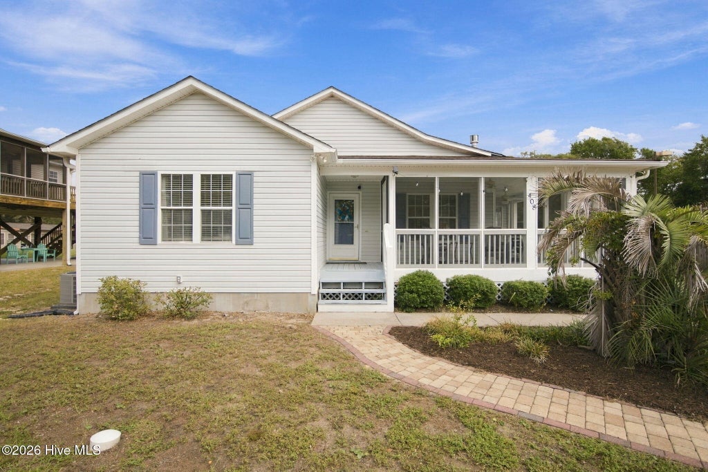 Photo of 408 Barbee Boulevard, Oak Island, NC 28465 (MLS # 100607618)