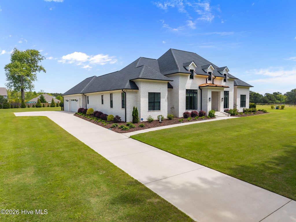 Photo of 47 E Rolling Meadows Road, Hampstead, NC 28443 (MLS # 100566934)