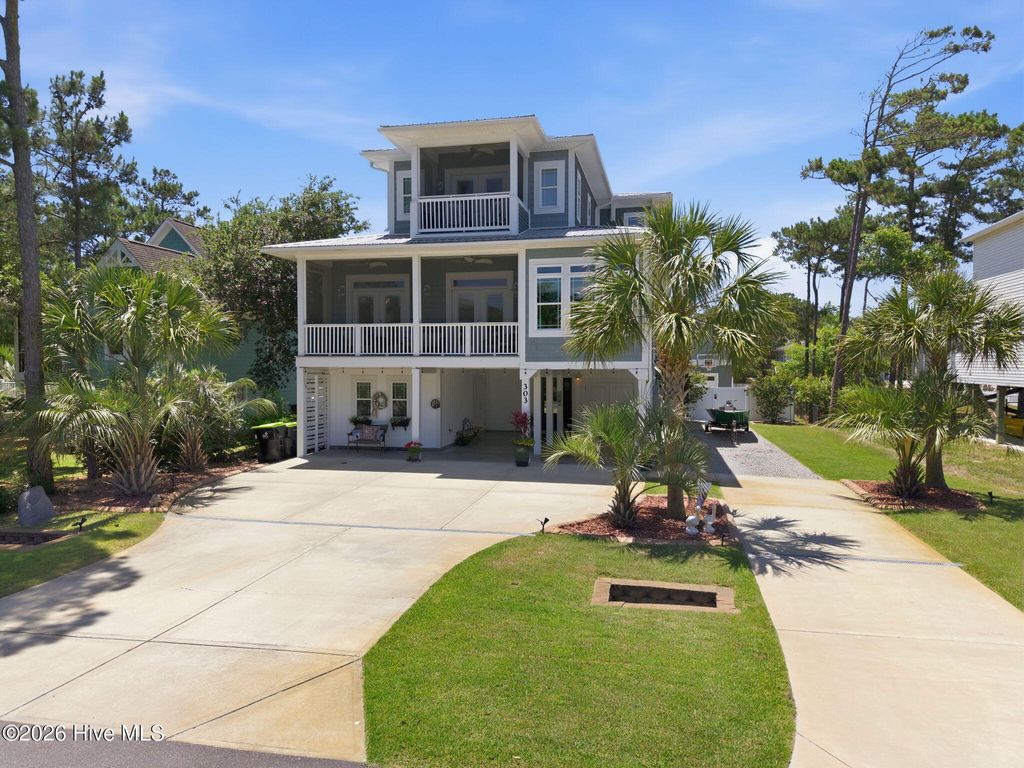 Photo of 303 Mcglamery Street, Oak Island, NC 28465 (MLS # 100576114)