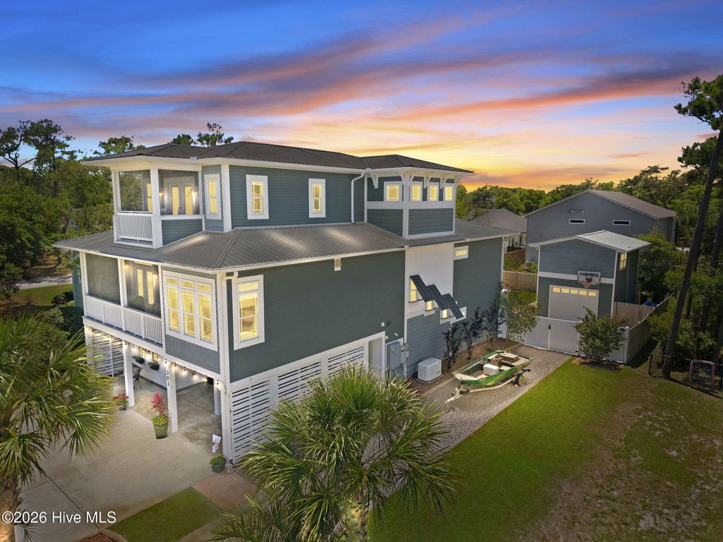Photo of 303 Mcglamery Street, Oak Island, NC 28465 (MLS # 100576114)