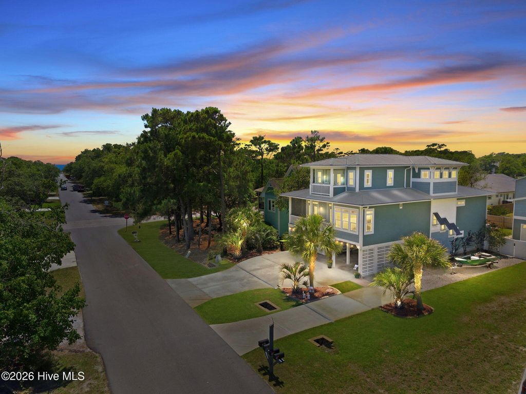 Photo of 303 Mcglamery Street, Oak Island, NC 28465 (MLS # 100576114)