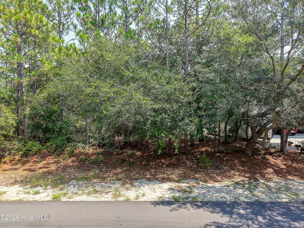 Photo of 158 NW 2nd Street, Oak Island, NC 28465 (MLS # 100612139)