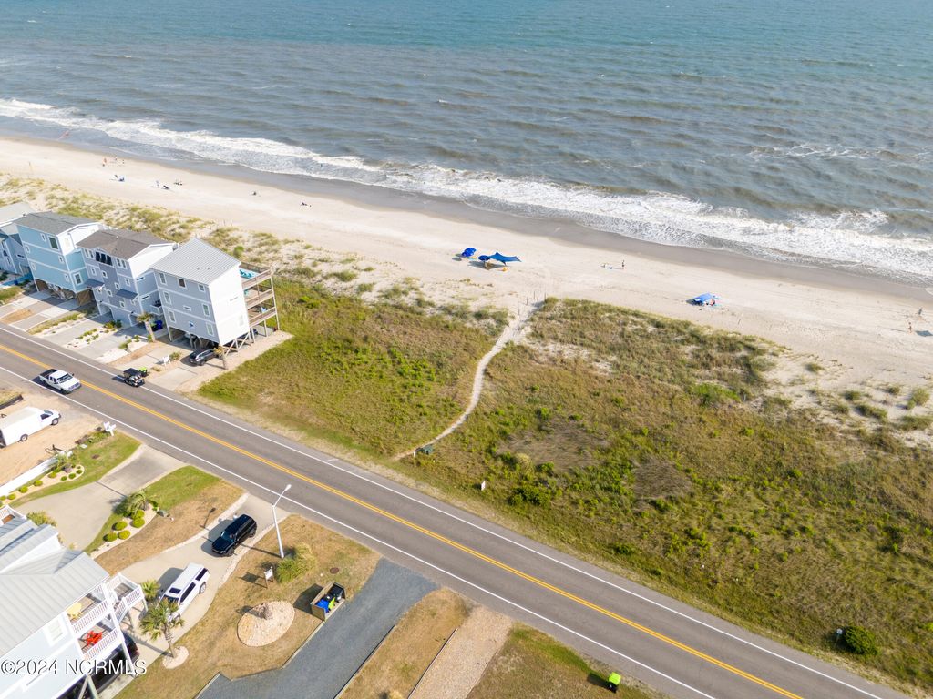 Photo of 5215 E Beach Drive, Oak Island, NC 28465 (MLS # 100449900)