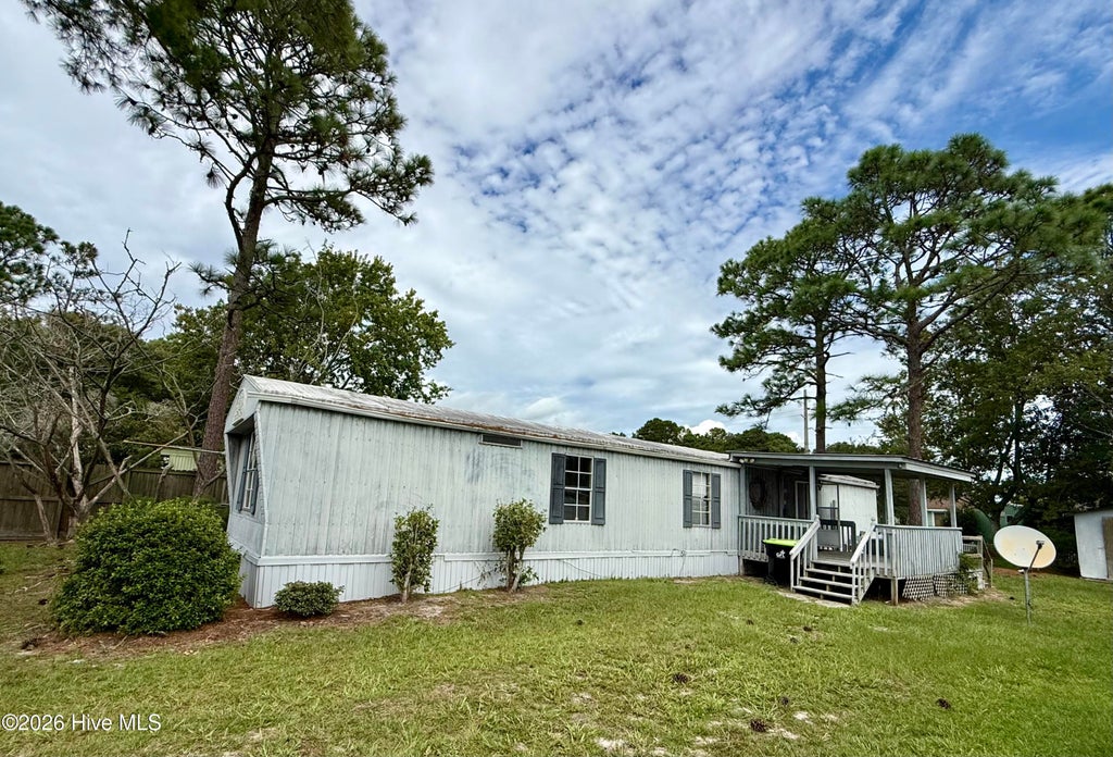 Photo of 919 Pineclair Drive SW, Calabash, NC 28467 (MLS # 100604192)