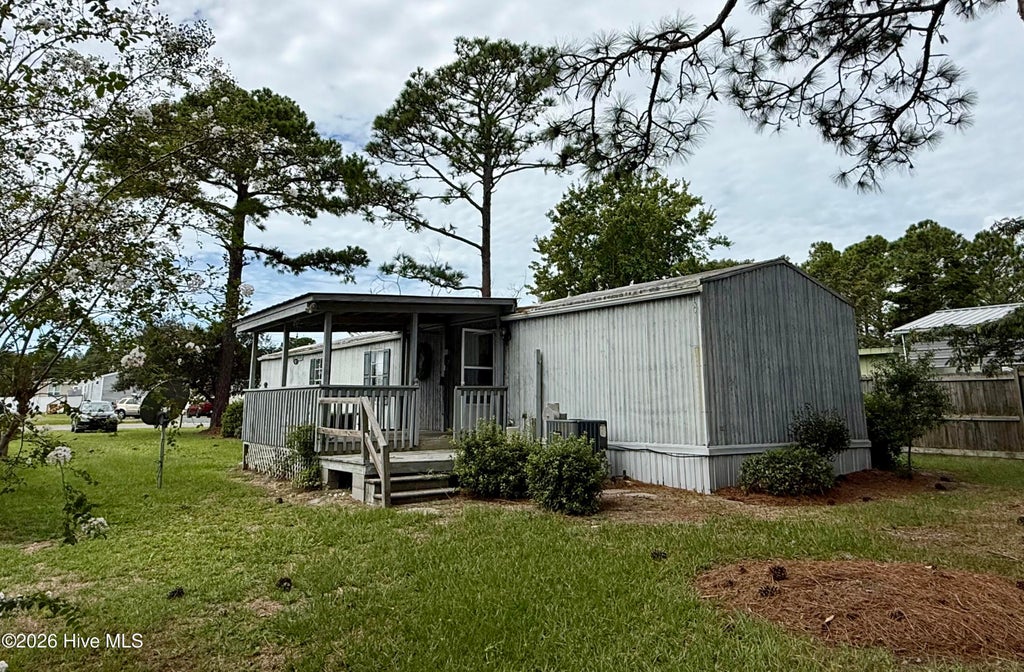 Photo of 919 Pineclair Drive SW, Calabash, NC 28467 (MLS # 100604192)