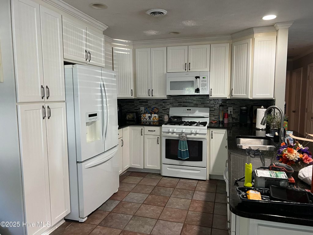 Photo of 114 NW 16th Street, Oak Island, NC 28465 (MLS # 100539947)