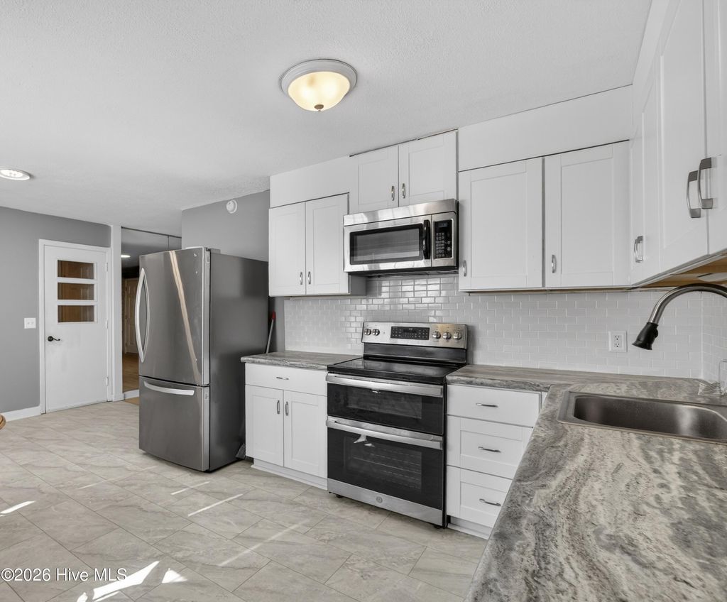 Photo of 102 Dixie Drive, Leland, NC 28451 (MLS # 100536383)