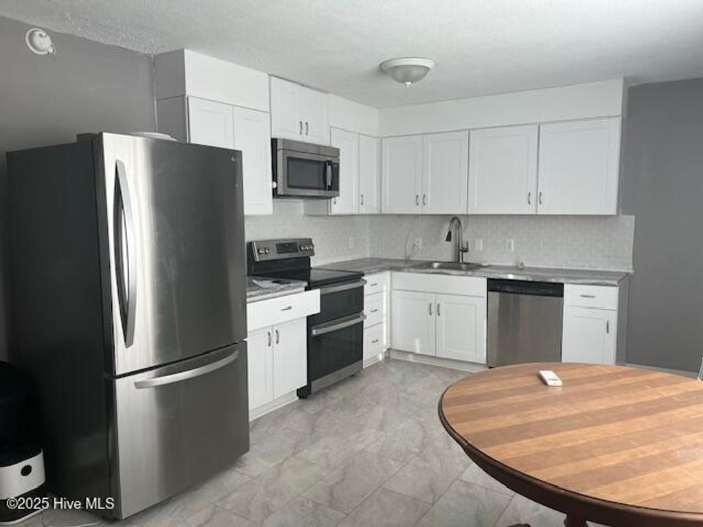 Photo of 102 Dixie Drive, Leland, NC 28451 (MLS # 100536383)