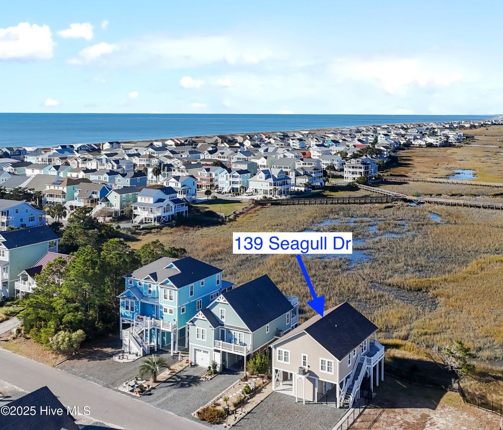 Photo of 139 Seagull Drive, Holden Beach, NC 28462 (MLS # 100541984)